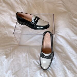 J. Crew women’s black and white leather colorblock penny loafers.